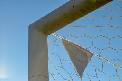 Low angle view of pole against clear blue sky