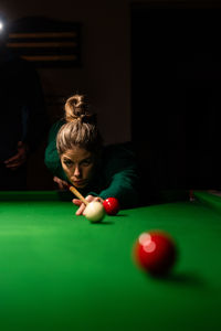 Cropped hand playing pool