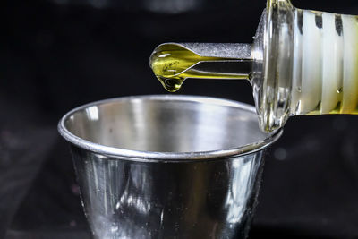 Close-up of water pouring from glass