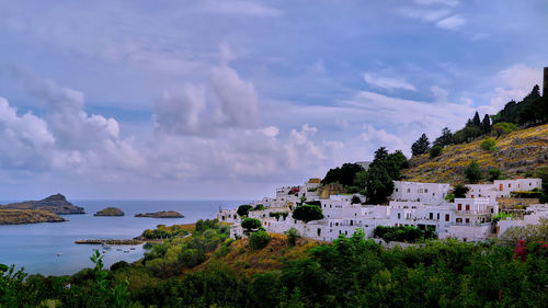 Panoramic view of townscape by sea against sky