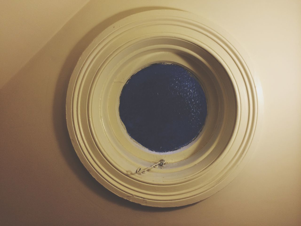 indoors, circle, close-up, geometric shape, no people, glass - material, reflection, directly above, lighting equipment, shape, transparent, high angle view, low angle view, window, copy space, mirror, glass, hole, directly below, still life