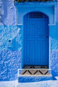 Closed blue door of house