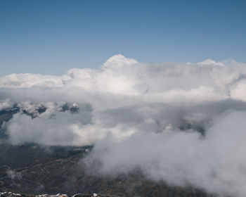 Aerial view of volcanic mountain against sky