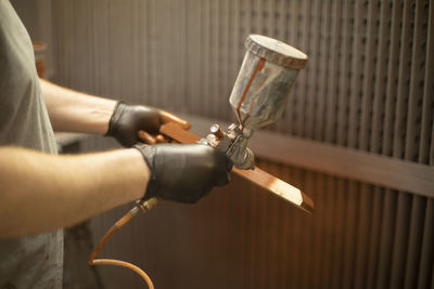 Cropped hand of man working at workshop