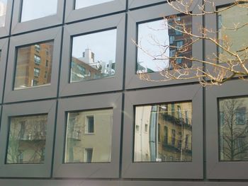 Low angle view of glass window of building