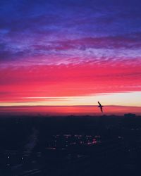 Scenic view of dramatic sky at sunset