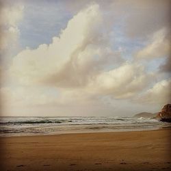 Scenic view of sea against cloudy sky