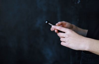 Close-up of hand holding smart phone