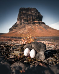 Scenic view of rocks on land against sky
