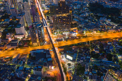 Aerial view of illuminated cityscape at dusk