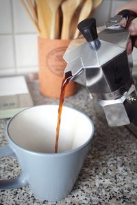 Close-up of pouring tea in cup