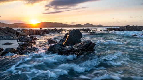 Scenic view of sea against sky during sunset