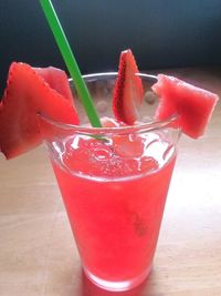 Close-up of red drink on table