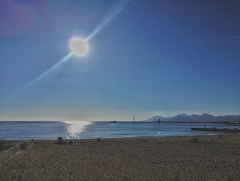 Scenic view of sea against blue sky