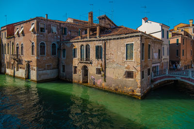 View of historic houses in the middle of venice's canals