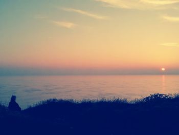 Scenic view of sea at sunset