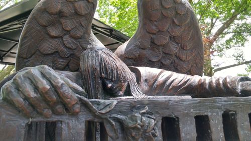 Close-up of horse statue against trees