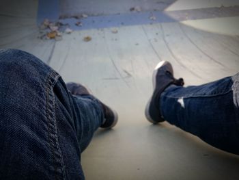 Low section of woman standing on tiled floor
