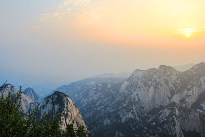 Scenic view of mountains against sky during sunset