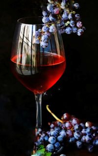 Close-up of red wine in glass on table