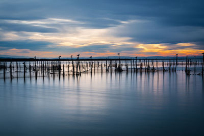 Scenic view of sea against sky at sunset