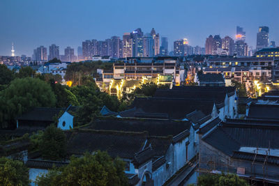 High angle view of illuminated buildings at night