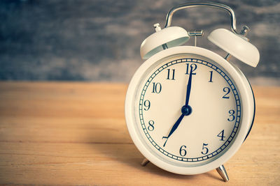 Close-up of clock on table