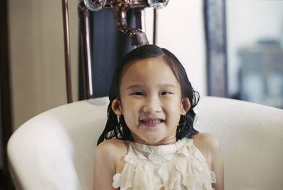 Portrait of cute smiling girl at home