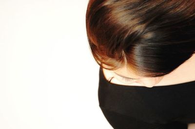 Close-up of woman over white background