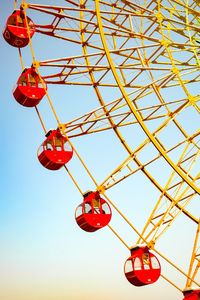 Low angle view of ferris wheel against sky