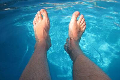 Low section of man in swimming pool