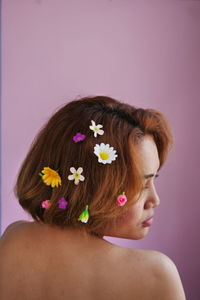 Rear view of woman with bouquet