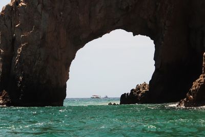 Scenic view of sea seen through cave