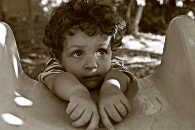 Cute boy on slide at playground