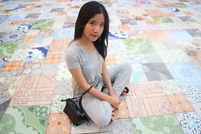 Young woman sitting at home