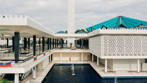 View of swimming pool against buildings