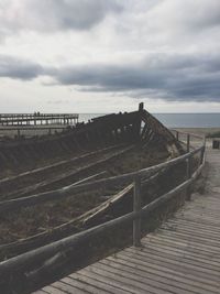 Pier over sea against sky