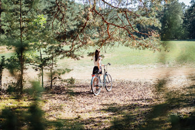 Mental health benefits of cycling, reduce anxiety. cycling in forest. forest bycycle trails. single