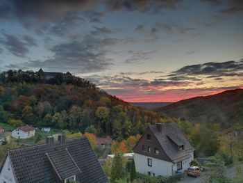 High angle view of buildings against sky during sunset