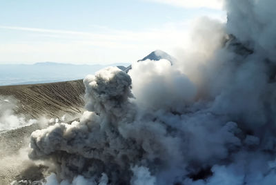 Scenic view of volcanic mountain against sky