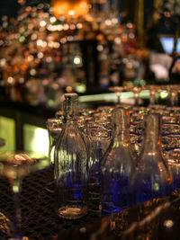 Close-up of wine bottles on table