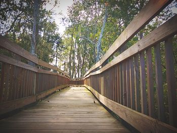 Footbridge against trees