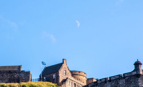 Low angle view of buildings against blue sky