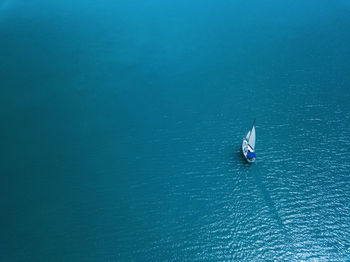 High angle view of sailboat sailing in sea
