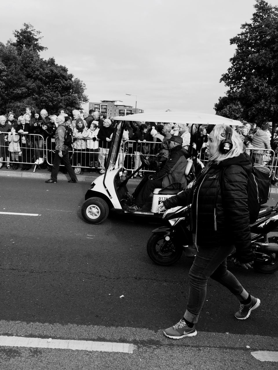 PEOPLE RIDING MOTORCYCLE ON STREET IN CITY