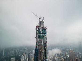 Modern buildings in city against sky