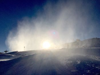 Panoramic view of people on snow against sky