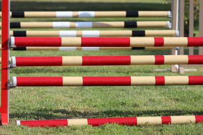 Close-up of multi colored pencils on soccer field