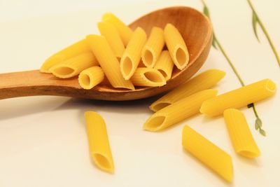 Close-up of yellow and bread on table