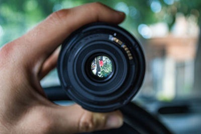 Close-up of hand holding camera